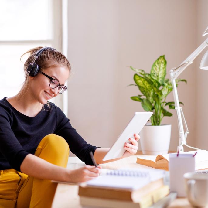 Photo of young woman in home office