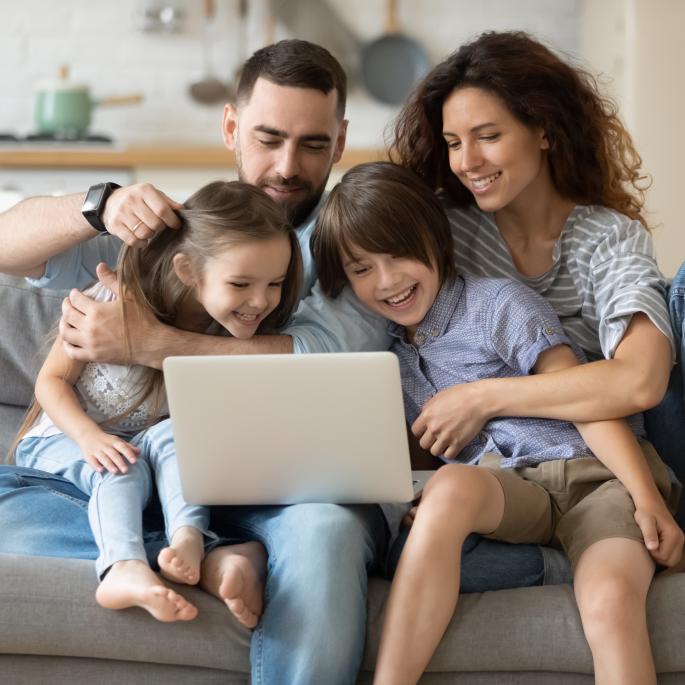 Family looking at a laptop